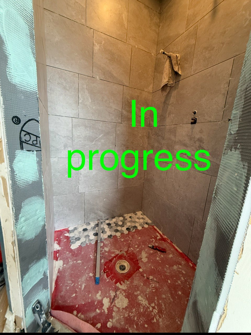 In Progress Installing Tiles in The Shower